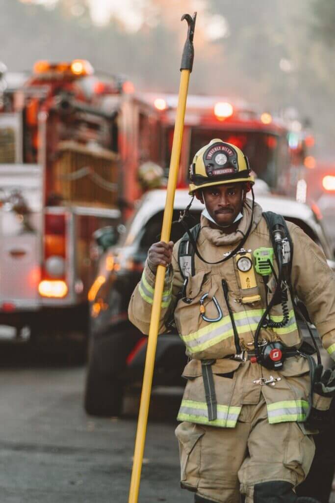 Firefighter on the scene  holding pick